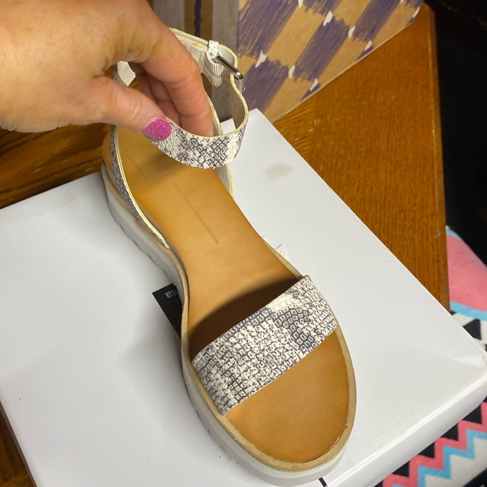 Snakeskin sandals wrap around ankle
